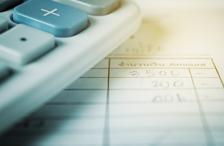 Utility bill with calculator, Save money and finance for banking concept filter color styleの写真素材