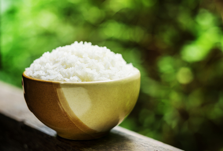 Rice, White rice in brown bowl on wooden in blurred backgroundの写真素材