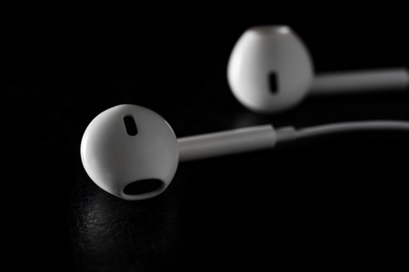 Ear headphone white on black background