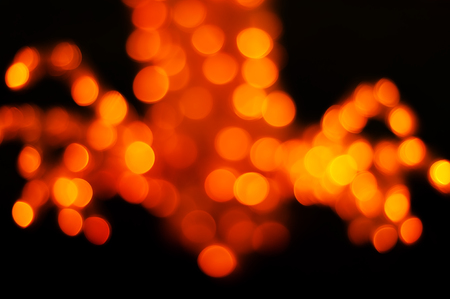 Bokeh christmas light night abstract colorful blurred on black backgroundの写真素材