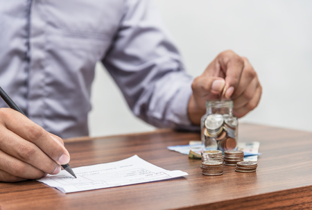 Save money and account banking for finance business concept, Man with bill and coin money on...