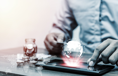 Technology network and online banking and internet banking and networking people concept, Save account banking for finance business concept, Business man with laptop and credit card with coin money on business office tableの写真素材