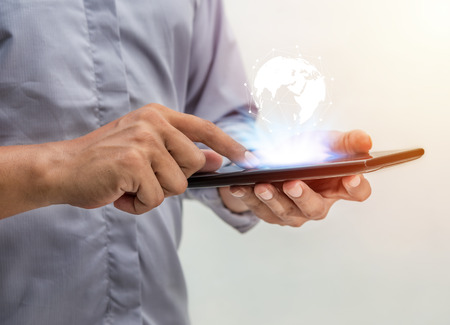 Technology people global network concept, Business man with laptop and virtual earth blurred...