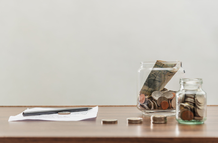 Save money and account banking for finance business concept, Row of coin money on business office table, Revenue and expeniture conceptの写真素材