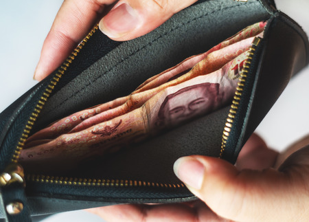 Save money and account banking for finance business concept, Currency money in black bag, Savings for retirement and investing conceptの写真素材