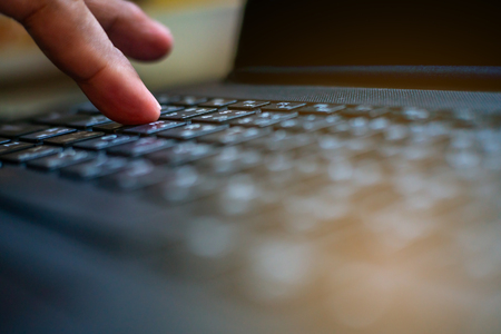 Technology and connecting concept, Hand human with keyboard on notebook computer blurred backgroundの写真素材