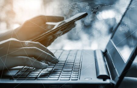Online shopping and online banking and internet banking concept, Hand with smart phone and laptop on...