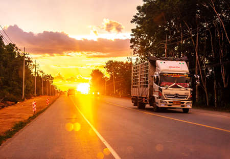 Pattalung, Thailand - August 29, 2020 : Truck on road with colorful of sunset or sunrise in twilightのeditorial素材