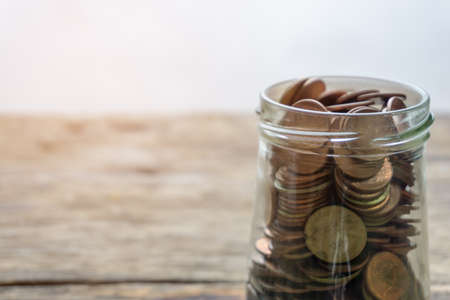 Save money and account banking for finance concept, Coin in bottle on blurred backgroundの写真素材