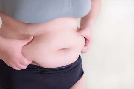 Fat women., Belly women Overweight, Shape up healthy stomach muscle, and diet lifestyle, to reduce belly concept.の写真素材