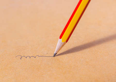 Mistake concept and Unsuccessful concept, Close up of a sharpened pencil writing crooked line, Team work conceptの写真素材