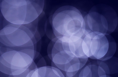 Light abstract dark bokeh christmas circle color glitter blurred black background