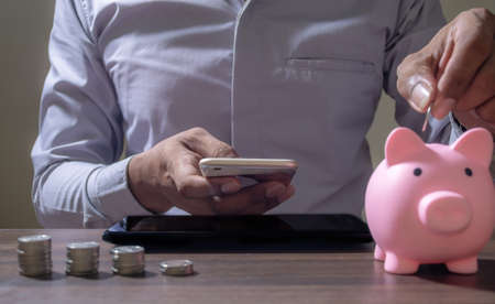 Online Banking And Internet Banking Savings Concept, Online Investment Savings, Online Stock Investors, Internet Financial Transactions, Save Monney for Investors Using Internet to Trade Stocks or Trade Fundの写真素材