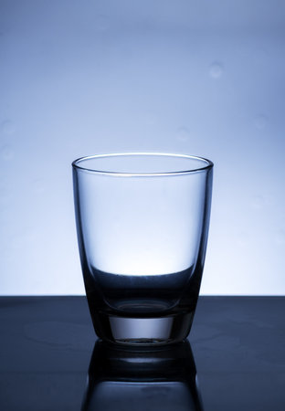 The image of pouring drinking water, into a glass, that makes one feel refreshed on blurred white background, Splashing water, Sparkling waterの写真素材