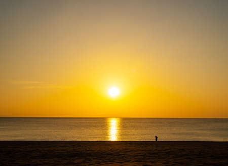 Beach sand sunset or sunrise with colorful of cloud sky and sunlight in twilightの写真素材