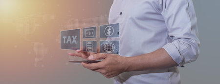 Hand young man uses tablet for Signing tax online, Offers online tax refund forms for paying taxes,...