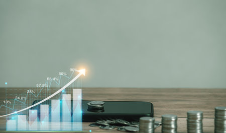 Smartphone mobile with coin and Value of money and investment for success and wealth analysis with...