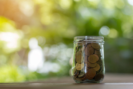 Growing money, Growth saving money and bank account for finance concept, Stack of coins soft blurred...