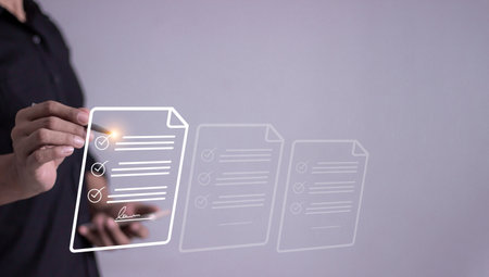 Young man with smartphone mobile hand hold a pen touching to sign a business contract online, Electronic signature, Digital documents, Future business contract signing, Online business contractの写真素材