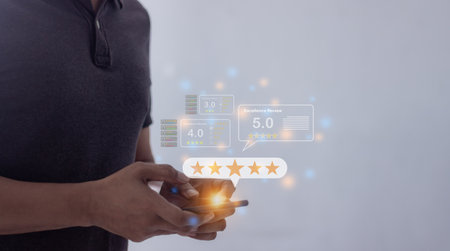 Review Excellence, Young Man hand holding Smart Phone with five star to review and give 5 stars with very good results in service, Good review 5 star rating choice feedbackの写真素材