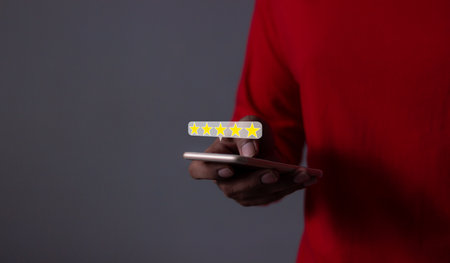 Customer Review, Young Man hand using smartphone mobile with five star to review and give 5 stars...