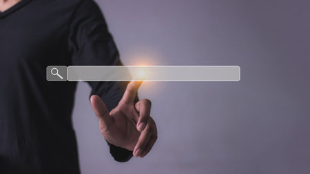 Young man with smartphone hand touching search bar.