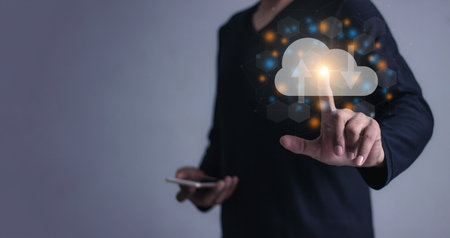 Young man with smartphone mobile hand touching to cloud computing diagram, Data storage, Cloud technology, Cloud Computing Storageの写真素材
