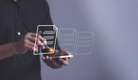 Young man with smartphone mobile hand using a pen touching to sign a Online Business Contract, Electronic signature, Contract signing, Digital documents, Future smart contractの写真素材