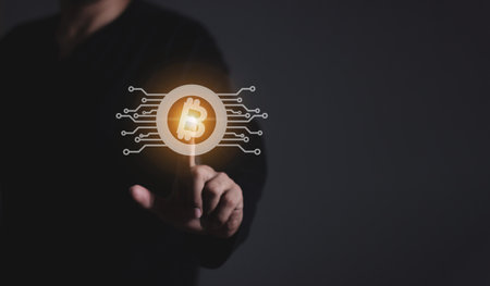 Young man using smartphone mobile hand touching to trade cryptocurrencies online, Investors in cryptocurrencies and bitcoin coins onlineの写真素材