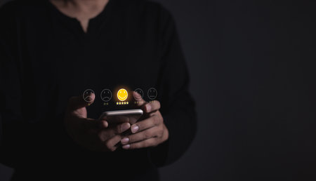 Happy Customer, Young Man hand touching emoji and five star to review and give 5 stars with very good results in service, Good review 5 star rating choice feedbackの写真素材