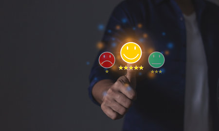 Happy Customer, Young Man hand touching five star to review and give 5 stars with very good results in service, Good review 5 star rating choice feedbackの写真素材
