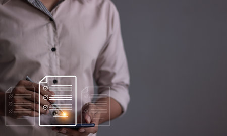 Young man with smartphone mobile hand using a pen touching to sign a Online Business Contract, Electronic signature, Contract signing, Digital documents, Future smart contractの写真素材