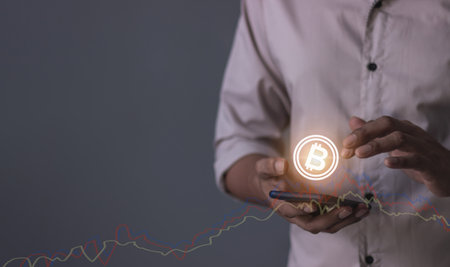 Young man with smartphone mobile hand touching to trade cryptocurrencies online, Investors in...