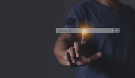 Young man hand touching search bar, Search jobの写真素材
