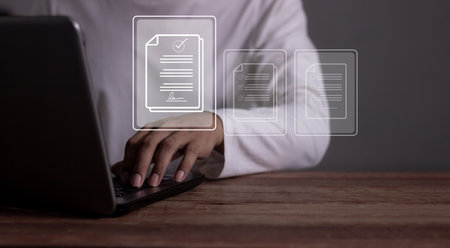 Young man hand with laptop to sign a Online Business Contract, Contract signing, Electronic signature, Digital documents, Future smart contractの写真素材