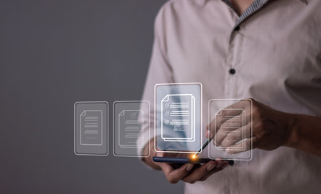 Young man with smartphone mobile hand using a pen touching to sign a Online Business Contract, Electronic signature, Contract signing, Digital documents, Future smart contractの写真素材