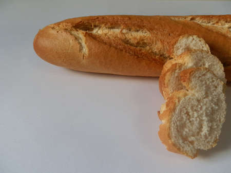 loaf and slices on white backgroundの写真素材