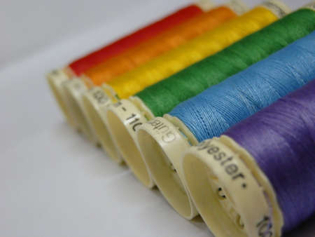 Gay flag made with spools of thread