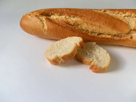 Loaf and slices on white backgroundの写真素材