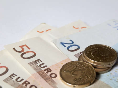 bills and money on white backgroundの写真素材