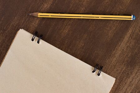 old notebook for aiming with pen on wooden tableの写真素材