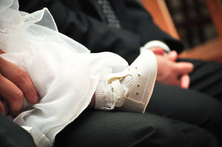 Baby white shoes with white dress.