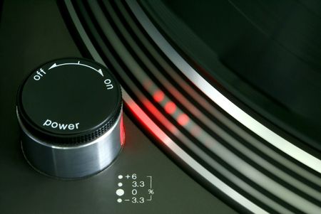 Red strobe light on record player turntable