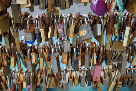 Padlocks fitted to a fence as tokens of loveの写真素材