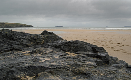 Rocks on a cornish sandy beachの写真素材