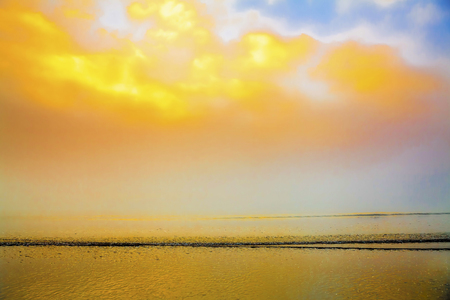 Sunrise foggy seaside beach seascapeの写真素材