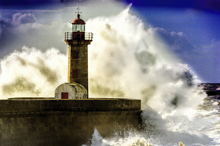 Porto lighthouse under attack by Atlnatic Ocean wavesの写真素材