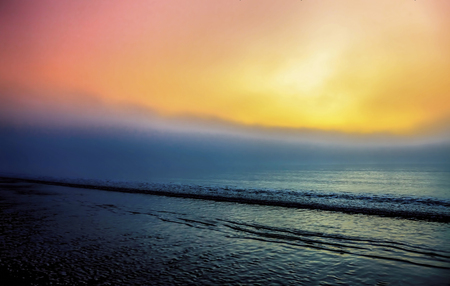Foggy morning sunrise seascapeの写真素材