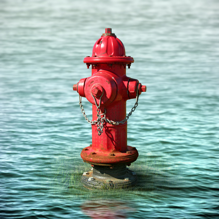 Photo illustration of a fire hydrant surrounded by flood waters.の写真素材