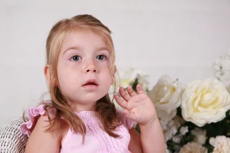 Cute 2 year old girl showing surprise or amazementの写真素材